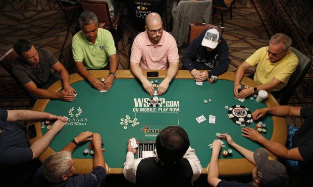 Players compete during the main event at the World Series of Poker Wednesday, July 8, 2015, in Las ...