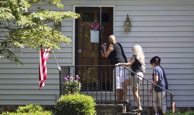 Mourners arrive at the home of Cathy Wells, the mother of Skip Wells, one of the four Marines kille...
