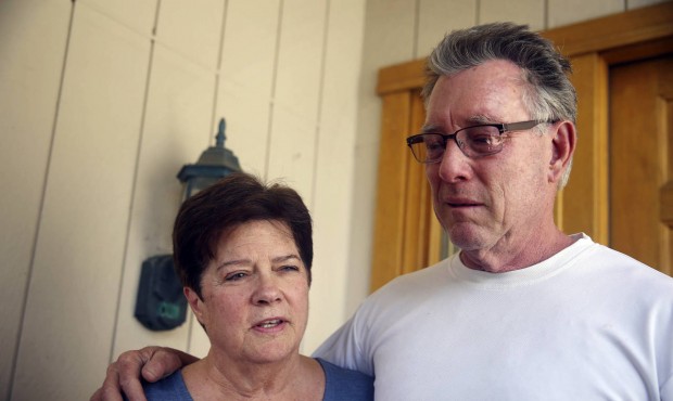 Liz Sullivan, left, and Jim Steinle, right, parents of Kathryn Steinle, talk to members of the medi...