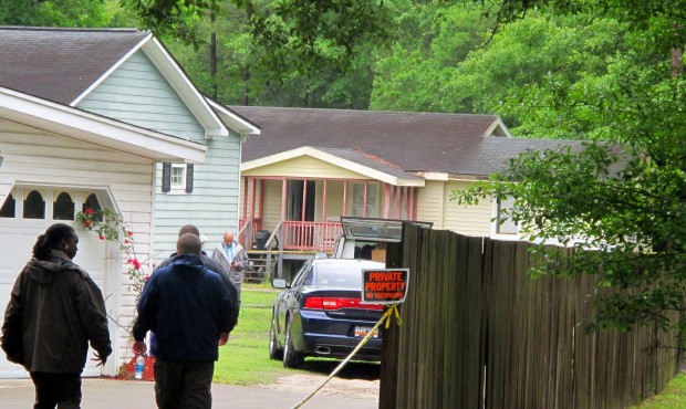 Investigators work at a scene of a shooting in Hollywood, S.C., Thursday, May 7, 2015. A sheriff&#8...