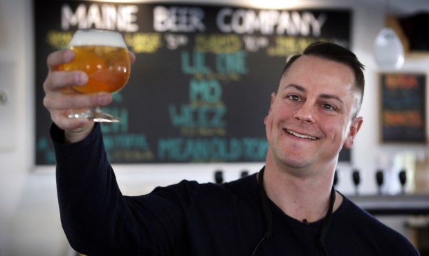 In this May 7, 2015 photo, Dan Kleban, a co-owner of the Maine Beer Company, poses in the company&#...