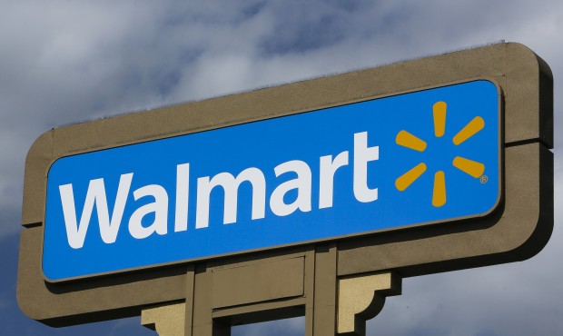 FILE – This May 28, 2013, file photo shows signage outside a Wal-Mart store in Duarte, Calif....