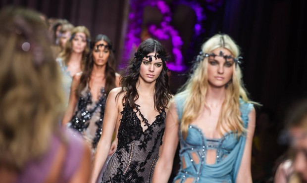 Kendall Jenner , centre, wears a creation for Italian fashion designer Donatella Versace’s fa...