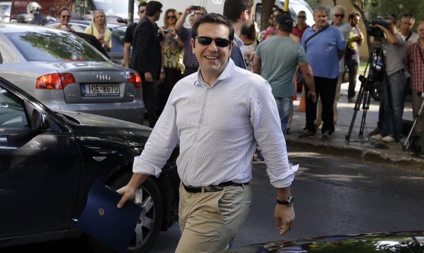 Greece’s Prime Minister Alexis Tsipras arrives at Syriza party headquarters for a meeting wit...