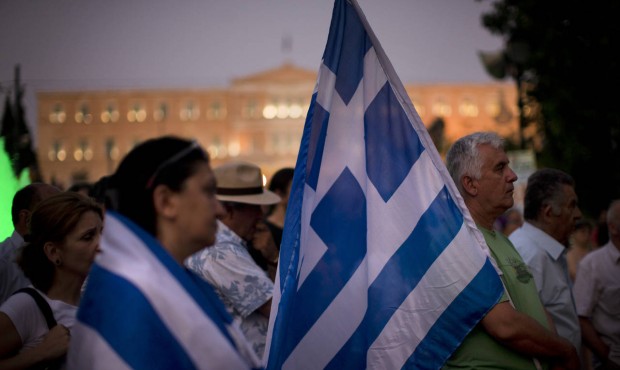 Demonstrators gather near the Greek Parliament during a rally against the government’s agreem...