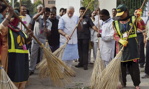 FILE – In this Thursday, Oct. 2, 2014 file photo, Indian Prime Minister Narendra Modi, center...
