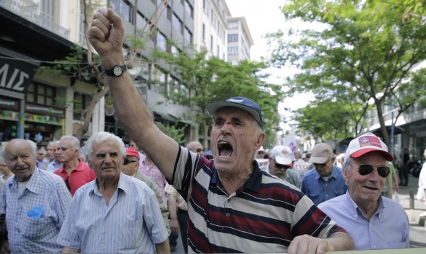 Pensioners chant anti austerity slogans during a protest in central Athens, on Wednesday, May 20, 2...