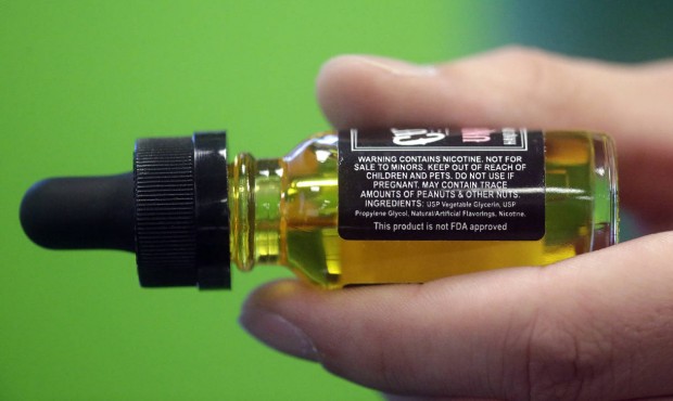 FILE – This Aug. 14, 2014 file photo shows the warning label on a child resistant bottle of l...