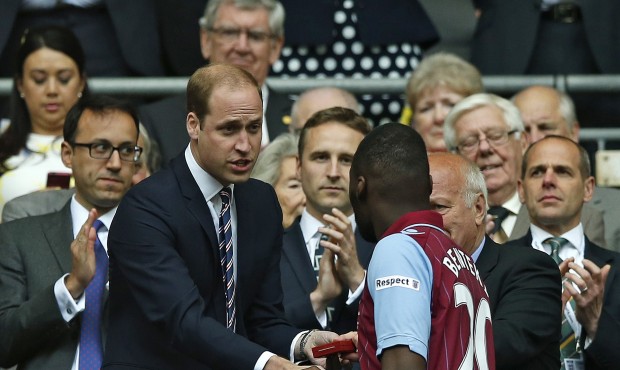 Britain’s Prince William, left, shakes hands with Aston Villa’s Christian Benteke after...