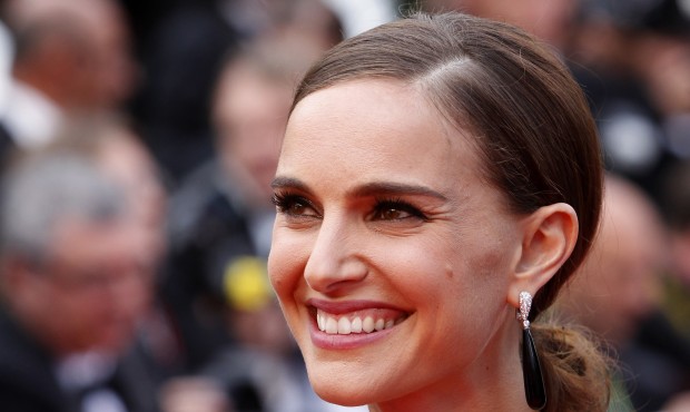Actress Natalie Portman poses for photographers as she arrives for the screening of the film Sicari...