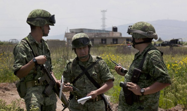 Soldiers guard the half-built house where drug lord Joaquin “El Chapo” Guzman made his ...