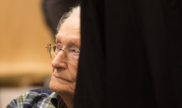 Former Auschwitz guard Oskar Groening, second left, sits in a courtroom prior to the start of his t...