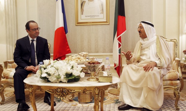 French President Francois Hollande listens to Sabah al-Ahmad al-Jabir al-Sabahm Emir of Kuweit, dur...