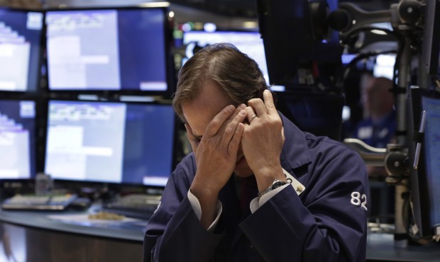 Trader Dudley Devine works on the floor of the New York Stock Exchange Thursday, May 21, 2015. U.S....