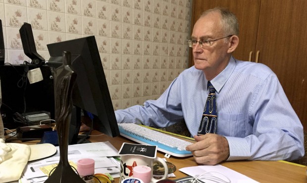 Alan Morison, Australian editor of the website Phuketwan, sits at his desk ahead of his appearance ...
