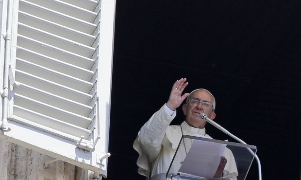Pope Francis delivers a blessing during the Angelus noon prayer he delivered from his studio’...