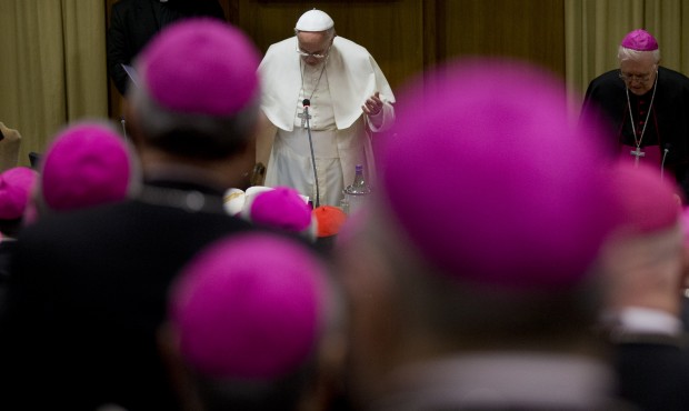 Pope Francis prays during the opening session of a Italian Episcopal Conference meeting, at the Vat...