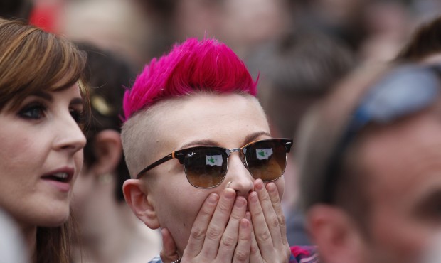 Yes supporters react at Dublin castle, Ireland, Saturday, May 23, 2015. Ireland has voted resoundin...