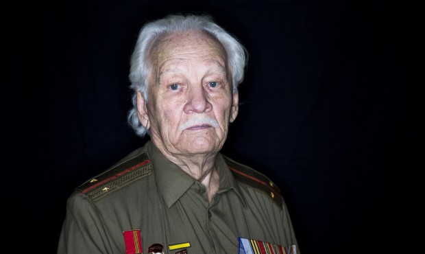 In this photo taken on Monday, April 27, 2015, WWII veteran Yuri Trankvillitsky, 90, poses for a ph...