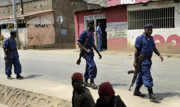 Policemen patrol the Musaga district of Bujumbura, Burundi, Monday July 20, 2015. Government repres...