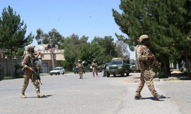 Afghanistan, security forces take position during a fighting outside a government compound in the c...