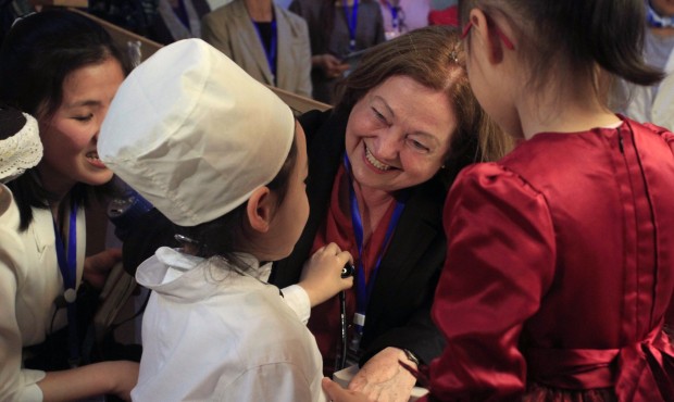 Nobel Peace Prize laureate Mairead Maguire, center, greets children at Kyongsang kindergarten in Py...