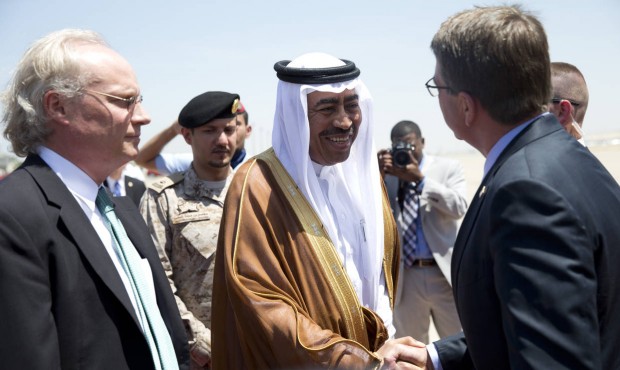 n U.S. Defense Secretary Ash Carter, right, is greeted by Saudi Arabian Assistant Minister of Defen...