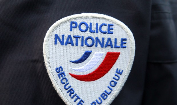 FILE – This March 18, 2015 file photo shows the logo of the French national police during a c...
