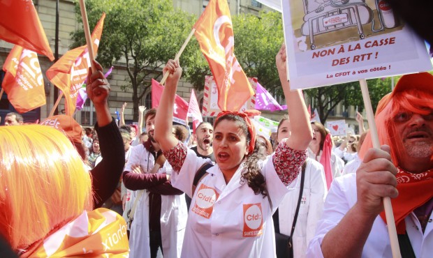 Technicians and nurses demonstrate in Paris, France, Thursday May 28, 2015, outside the headquarter...