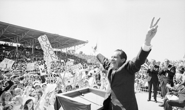 FILE – In this Sept. 19, 1968, file photo, then-presidential candidate Richard Nixon flashes ...