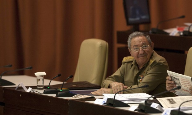 Cuba’s President Raul Castro attends a National Assembly session, as he sits next to the chai...