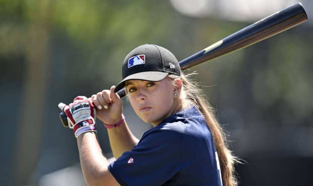 Melissa Mayeux holds the bat as she poses at a baseball camp in Paderborn, Germany, Wednesday, July...