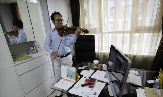 In this June 24, 2015 photo, South Korean violinist Won Hyung Joon performs during an interview at ...