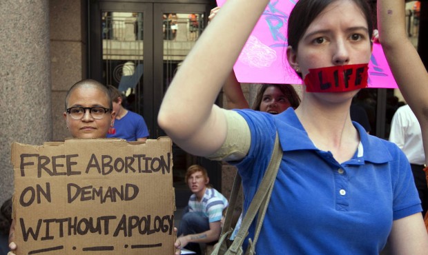 FILE – In a Tuesday July 2, 2013 file photo, pro-abortion rights supporter Yatzel Sabat, left...