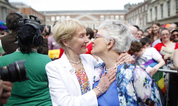 Irish Senator Katherine Zappone, right, and partner Ann Louise Gilligan celebrate as the first resu...