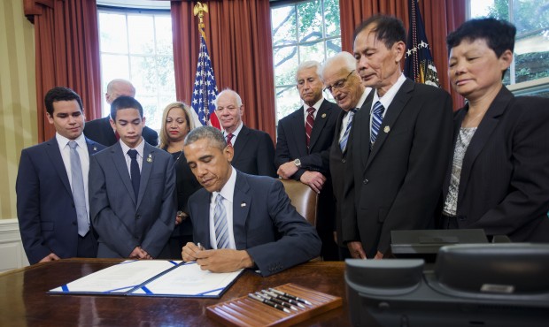 President Barack Obama signs S. 665, the Rafael Ramos and Wenjian Liu National Blue Alert Act of 20...