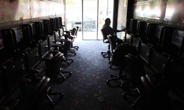 A man plays an electronic slot machine at a virtual casino in the Rio Piedras neighborhood of San J...
