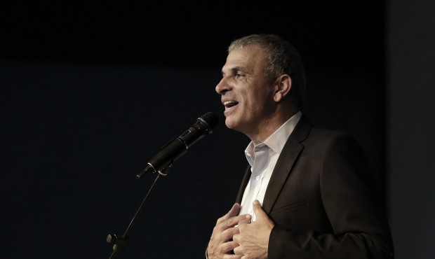 FILE – In this Wednesday, March 18, 2015 file photo, Moshe Kahlon, Kulanu party leader, greet...