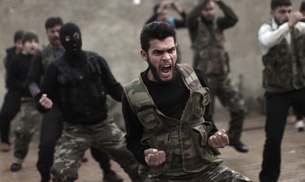 FILE – In this Dec. 17, 2012 file photo, Syrian rebels attend a training session in Maaret Ik...