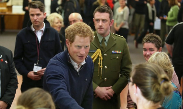 Britain’s Prince Harry, center, visits the Stewart Island Community Centre as part of his fir...