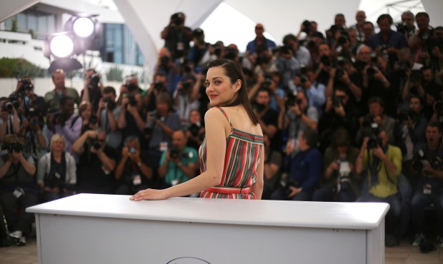 Marion Cotillard poses for photographers during a photo call for the film Macbeth, at the 68th inte...