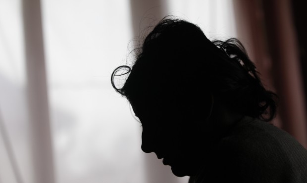 In this March 2, 2015 photo, Klara Balogova is silhouetted against a window at a Roma settlement ne...