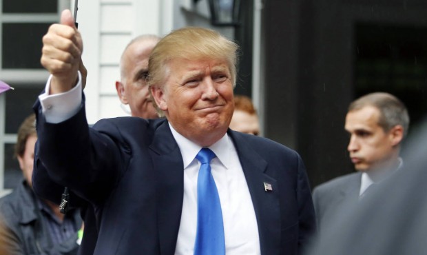 Republican presidential candidate Donald Trump waves as he arrives at a house party Tuesday, June 3...
