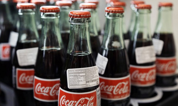 In this July 9, 2015 photo, bottles of Coca-Cola are on display at a Haverhill, Mass. supermarket. ...