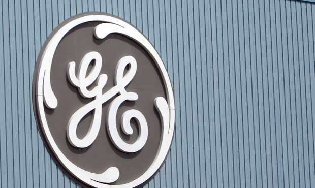 FILE – This June 24, 2014, file photo, shows the General Electric logo at a plant in Belfort,...