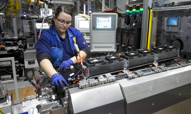 FILE – In this Jan. 20, 2015 file photo BMW employee Sandra Altmannshofer works at the produc...