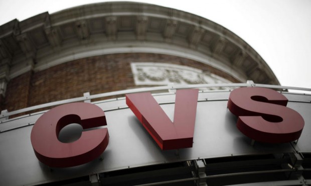 FILE – This June 20, 2011 photo shows signage at a CVS store in Philadelphia. CVS drugstores ...