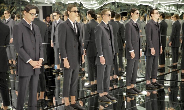 n Models stand in a mirrored room during a presentation by Thom Browne at Men’s Fashion Week ...