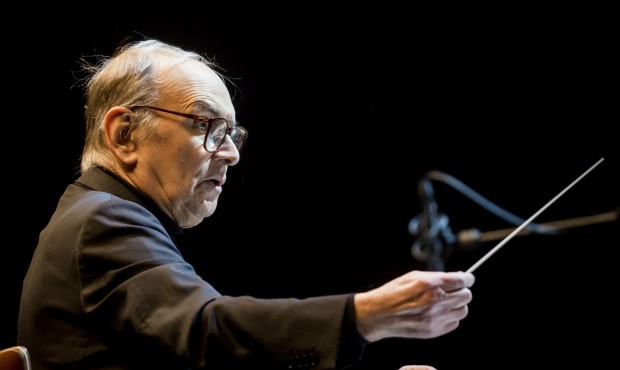 FILE — In this Feb. 15, 2014 file photo Italian composer Ennio Morricone conducts the Modern ...