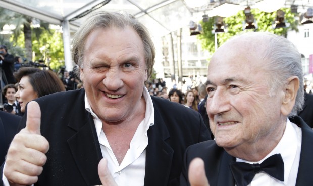 FILE – In this Sunday, May 18, 2014 file photo FIFA President Sepp Blatter, right, and actor ...